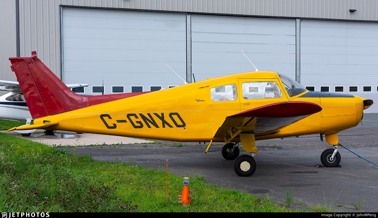 Photograph of a Beechcraft A23 Musketeer registered C-GNXO, operated privately. The aircraft, serial number MB-91, is pictured on the ramp at Fredericton Airport (CYFC), Canada. Photo by JohnMPeng.